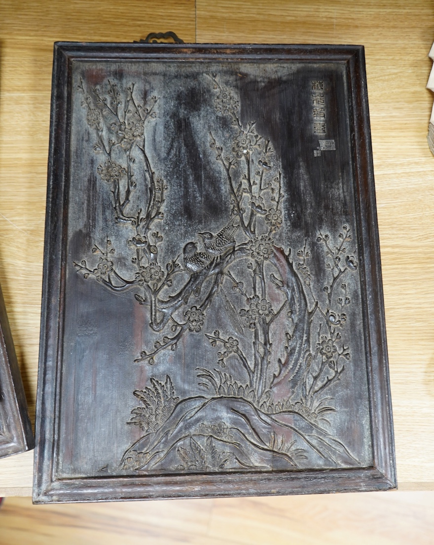 Four Chinese carved bamboo panels decorated with bamboo, trees, birds, etc. 48 x 34.5cm. Condition - fair to good.